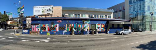 Exterior shot of the stud bar in San Francisco, CA. Image captured in June of 2020 during the COVID pandemic while San Francisco was still shutdown. The exterior of the building is covered in graffiti and murals by various queer artists.