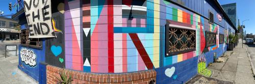 Exterior shot of the stud bar in San Francisco, CA. Image captured in June of 2020 during the COVID pandemic while San Francisco was still shutdown. The exterior of the building is covered in graffiti and murals by various queer artists.