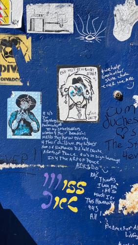 Exterior shot of the stud bar in San Francisco, CA. Image captured in June of 2020 during the COVID pandemic while San Francisco was still shutdown. The exterior of the building is covered in graffiti and murals by various queer artists.